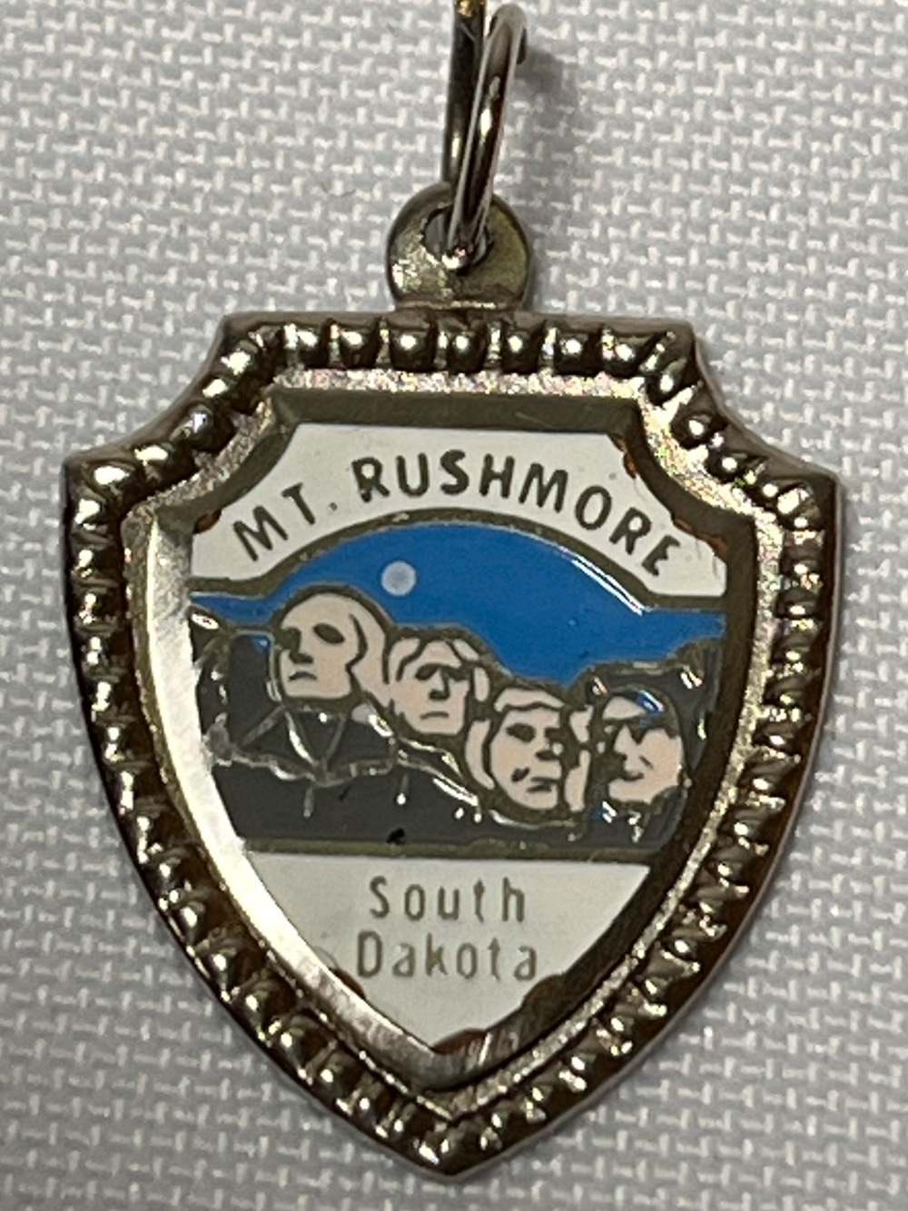 Mt. Rushmore South Dakota Blue and Silver Shield Pendant
Vintage